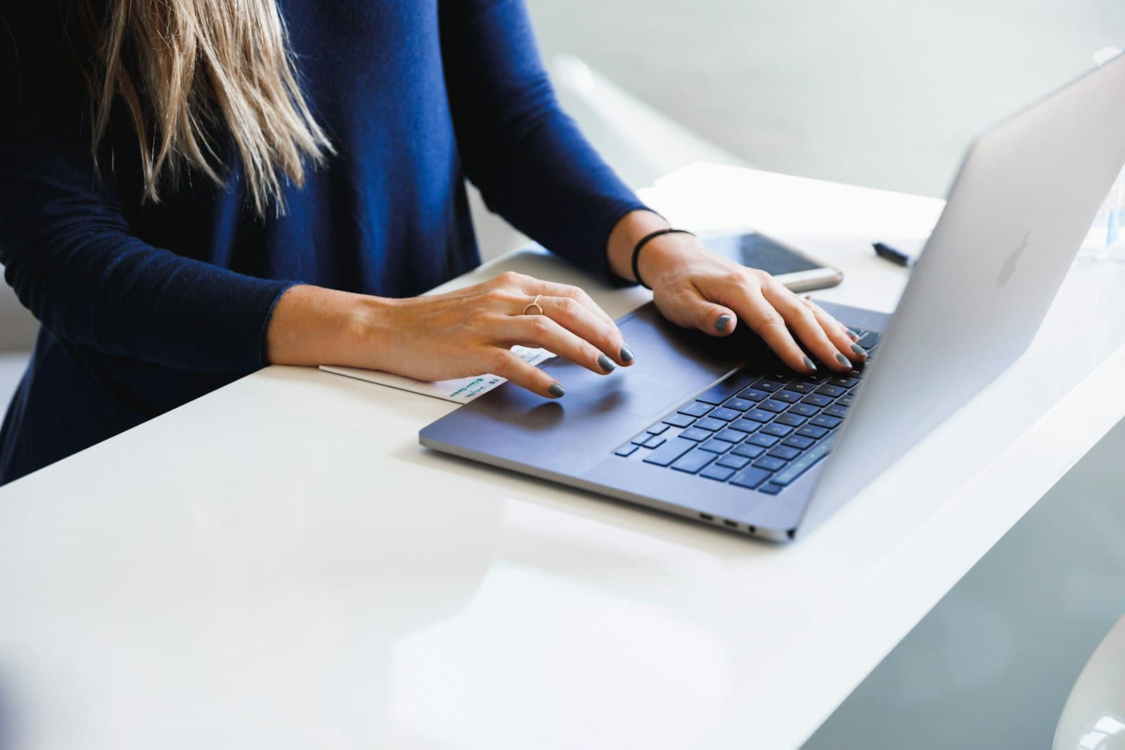 A support coordinator working at a laptop